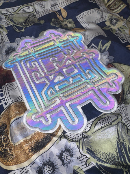 Griz Tea Time Windbreaker reflective embroidery shining under light