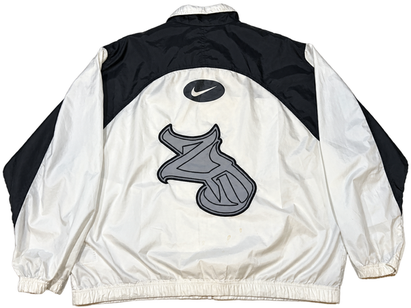 Nike 2D Windbreaker back with large gray 2D patch