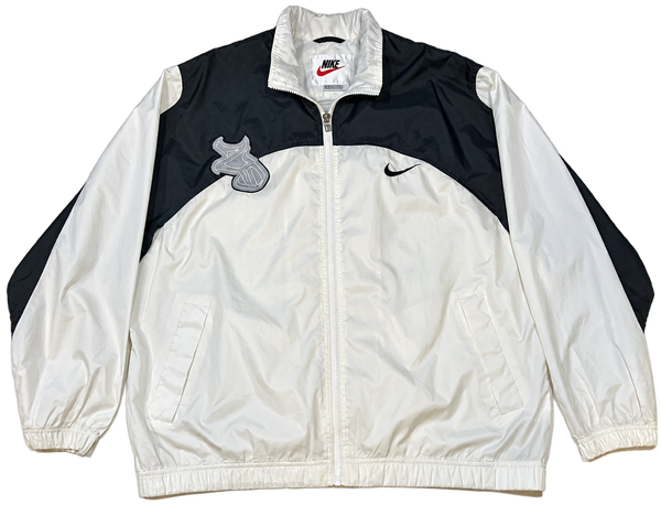 Nike 2D Windbreaker front with black and white panels and gray 2D chest patch